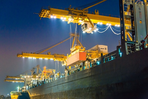 cargo ship in the harbor at night picture id517466402