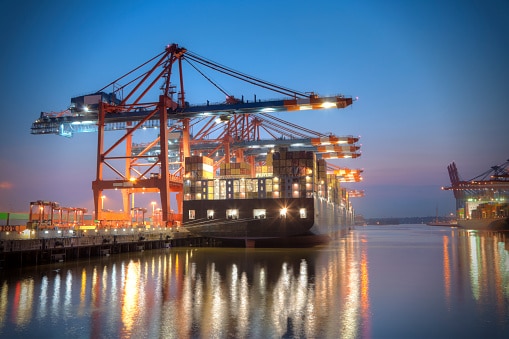 ship-docked-at-a-harbour-at-night-time-picture-id117144640 ship docked at a harbour at night time picture id117144640