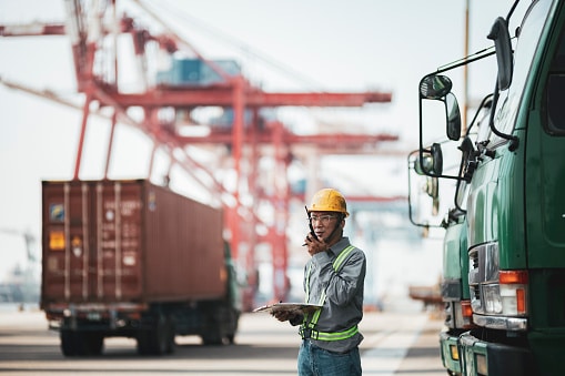 worker using walkietalkie in commercial dock picture id1343491755