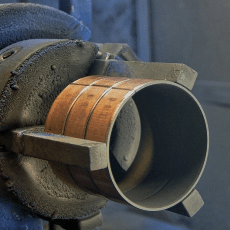 Self-lubricating steel bushing